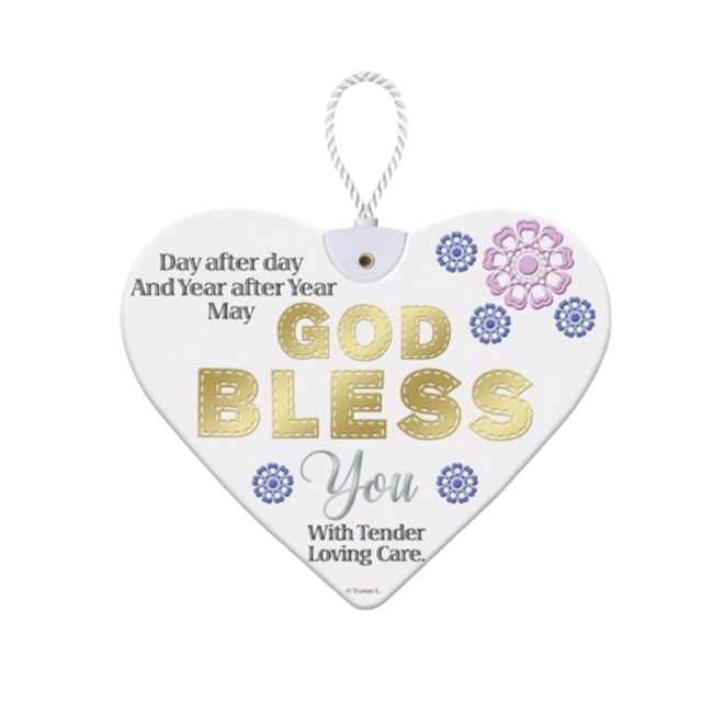Heartfelt By Sensations God Bless White ceramic heart plaque with gold God Bless text and floral decorations hanging by a white cord