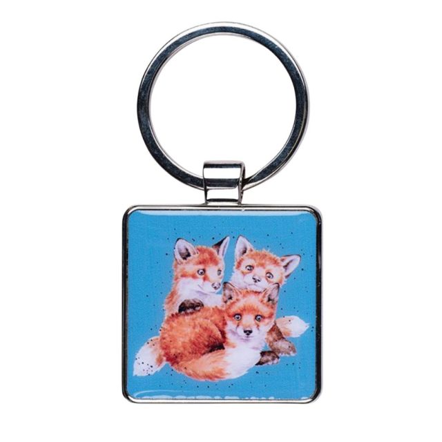 Square keyring with 'Snug as a Cub' fox design on a blue background