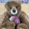 Close-up of Charlie Bears Boggle face showing brown fur and black plastic eyes