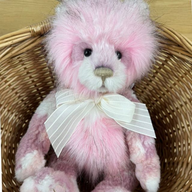 Charlie Bears Julia Plumo Collection Charlie Bears Julia limited edition pink bear with white striped bow sitting in wicker basket