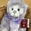 Charlie Meghan Charlie Bears Meghan plush bear showing detailed face and lilac bow with tag