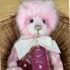 Julia Charlie Bears Close-up of Charlie Bears Julia pink plush bear wearing white bow with tags