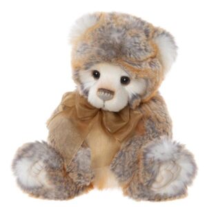 Charlie Bears Rhys plush bear with white grey and orange fur wearing an orange bow