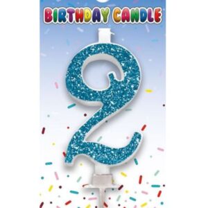 Blue glitter number 2 birthday candle from Sensations on packaging with confetti background