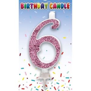 Pink glitter birthday candle shaped as the number 6 in packaging