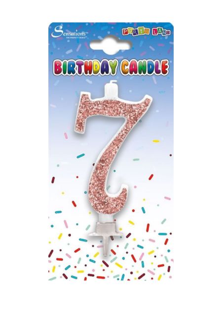 Rose gold glitter birthday candle shaped as number 7 in clear packaging