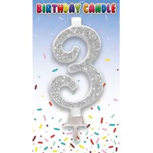 Silver glitter number 3 birthday candle on party packaging