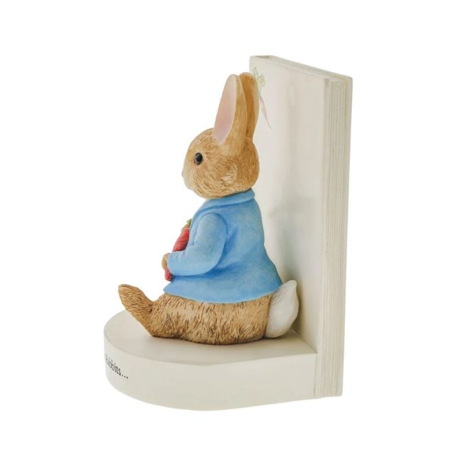 Rear angle of Peter Rabbit book stop showing detailed cast stone figure seated