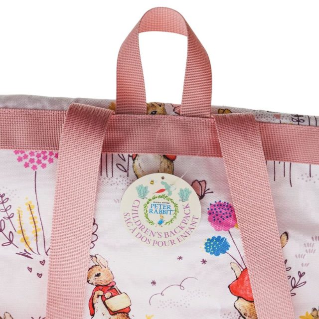 Flopsy Backpack Close-up of Flopsy Childrens Backpack top handle and Peter Rabbit tag on waterproof fabric lining