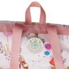 Flopsy Backpack Close-up of Flopsy Childrens Backpack top handle and Peter Rabbit tag on waterproof fabric lining