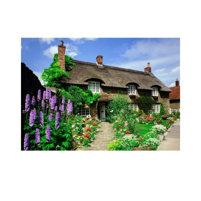 House of Puzzles Delightful Dales Thatched cottage surrounded by colourful garden flowers in the Delightful Dales jigsaw puzzle
