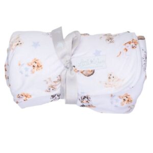 Rolled up Wrendale Little Paws baby blanket tied with grosgrain ribbon featuring dog illustrations