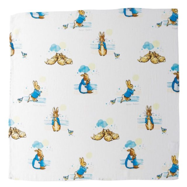 White muslin square featuring Peter Rabbit characters and blue clouds