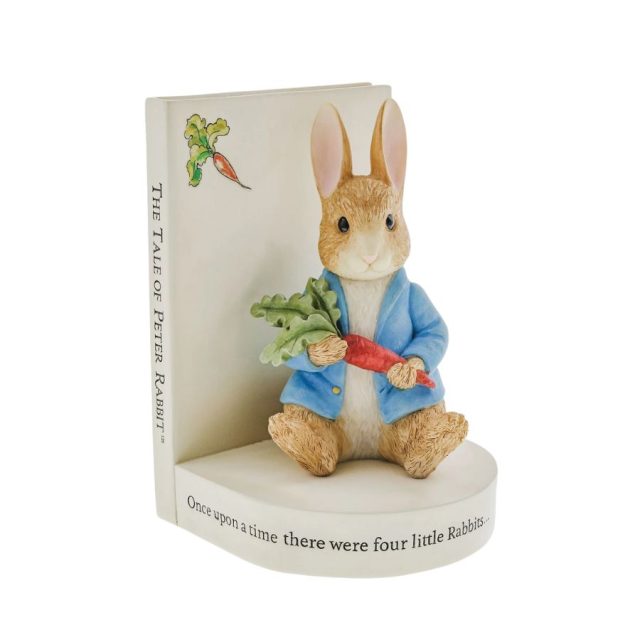 Peter Rabbit bookend holding a carrot with The Tale of Peter Rabbit book design