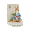 Peter Rabbit bookend holding a carrot with The Tale of Peter Rabbit book design