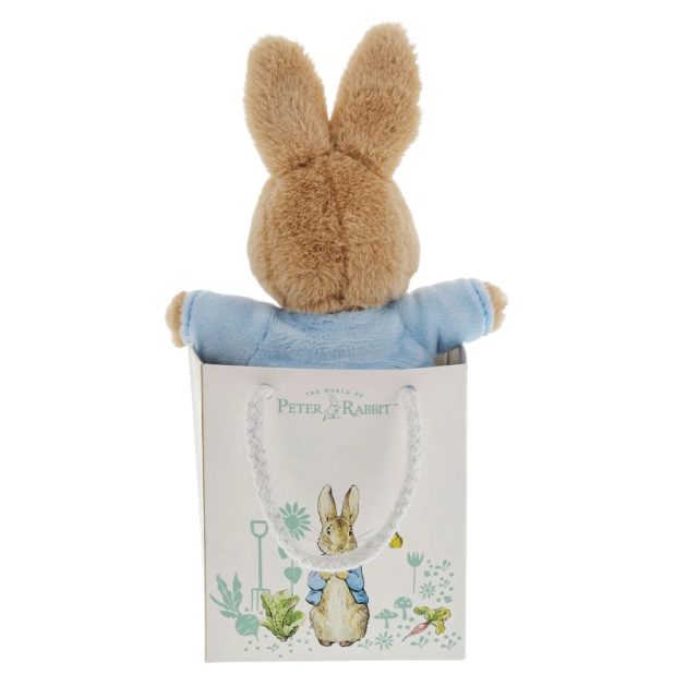 Peter Rabbit - Gift Bag Rear view of Peter Rabbit soft toy in blue jacket sitting inside a decorative Peter Rabbit gift bag