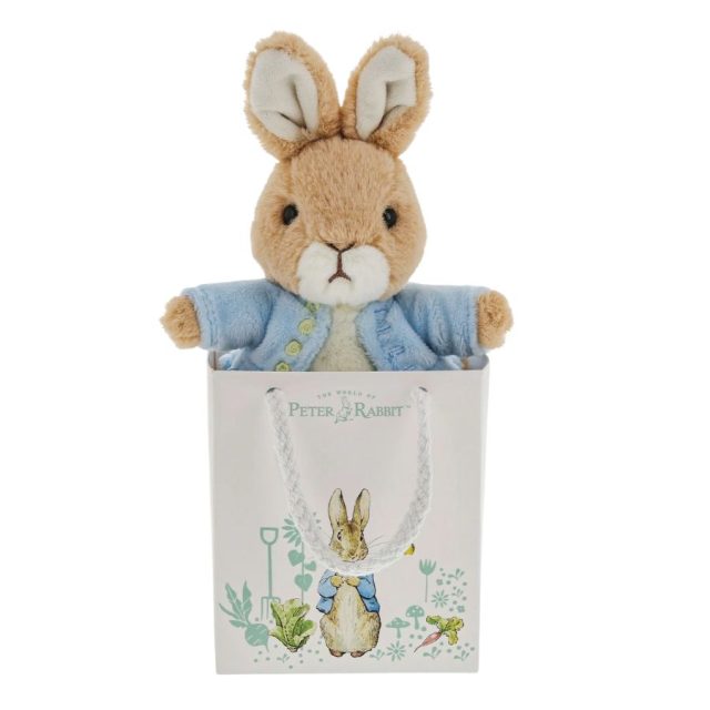Peter Rabbit - Gift Bag (2) Peter Rabbit soft toy wearing blue jacket inside decorative gift bag with Peter Rabbit illustration