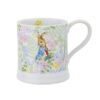 Peter Rabbit with Radish English Garden Mug Peter Rabbit illustrated on ceramic mug with blue jacket and radish surrounded by floral pattern