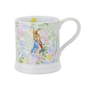 Peter Rabbit illustrated on ceramic mug with blue jacket and radish surrounded by floral pattern