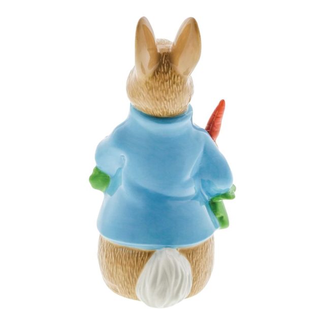 Peter Rabbit with Radishes Figurine (1) Rear view of Peter Rabbit porcelain figurine with blue jacket and one radish