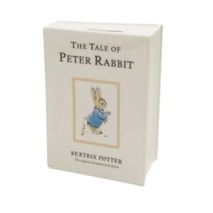 Ceramic money bank shaped like The Tale of Peter Rabbit book with classic illustration