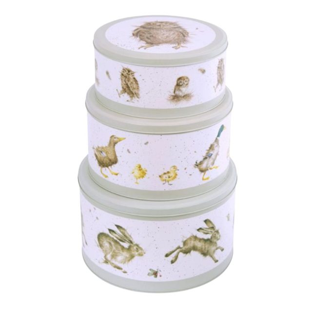 Stacked Wrendale green cake tins featuring hares, ducks and owls illustrations