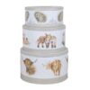 Three grey cake tins with illustrations of hedgehogs, foxes and highland cows on a white background