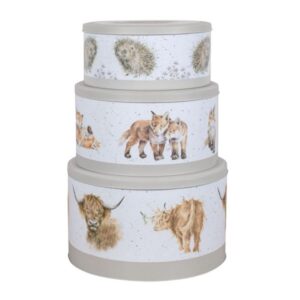 Three grey cake tins with illustrations of hedgehogs, foxes and highland cows on a white background