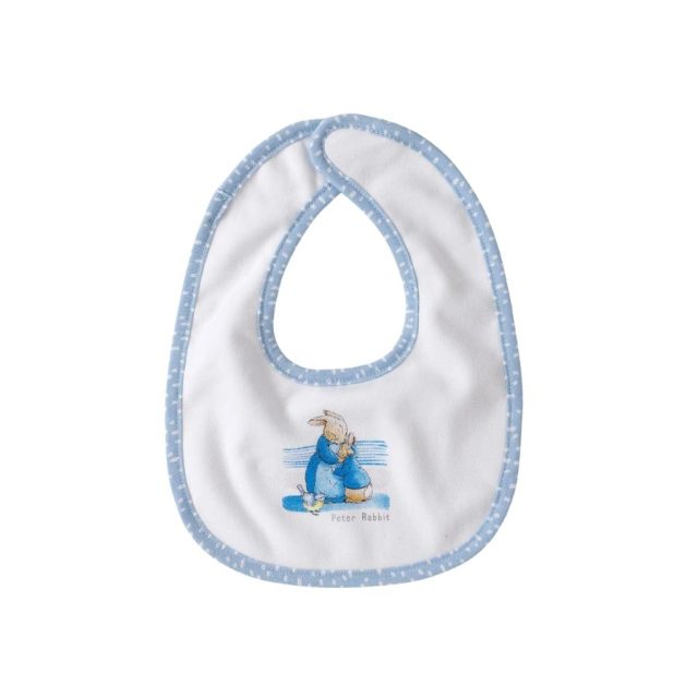 White baby bib with blue trim showing Peter Rabbit sitting down illustration