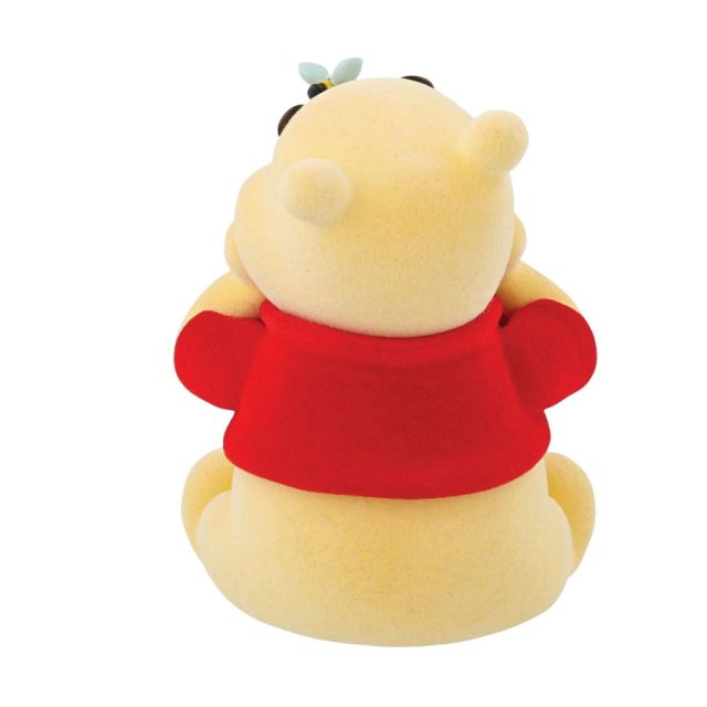 Rear view of flocked Winnie the Pooh figurine showing red shirt and bumble bee on nose