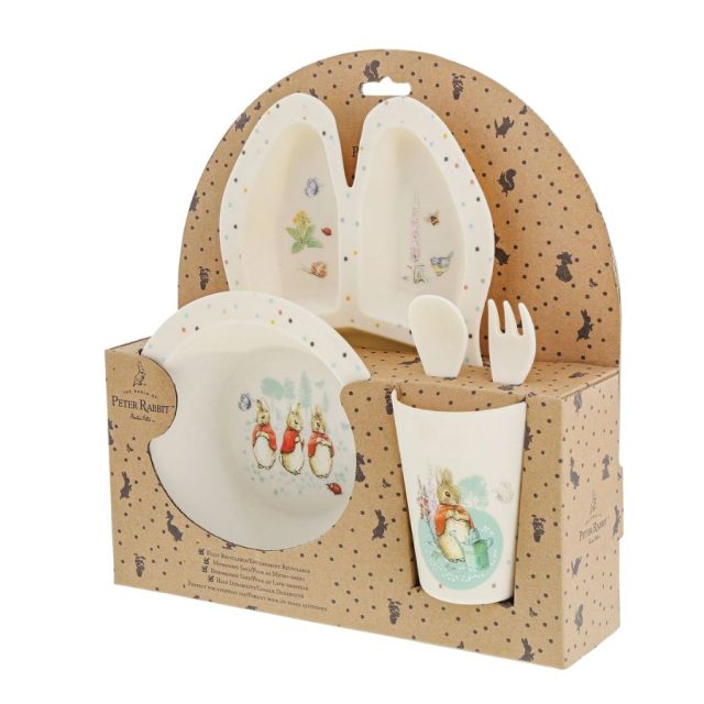 Flopsy Dinner Set Side view of Flopsy Dinner Set by Beatrix Potter with plate, bowl, cup, fork and spoon in packaging