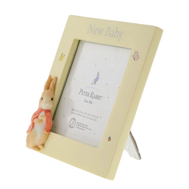 Side angled view of Flopsy New Baby Photo Frame showing Peter Rabbit figure and photo slot