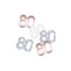 Loose rose gold and silver 80 number confetti pieces scattered on white background