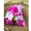 CB256122O Raspberry Ripple Charlie Bears Raspberry Ripple sitting in a woven basket showing vibrant pink and white fluffy fur