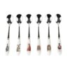 Set of six tea spoons with different country animal illustrations on white ceramic handles