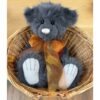Armstrong Charlie Bears Charlie Bears Armstrong plush bear sitting inside wicker basket showing soft grey fur and bow