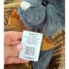 Charlie Bears Armstrong CB256061O Close-up of Charlie Bears Armstrong tag held by hand detailing product and care information