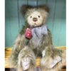 Charlie Bears CB252559 Charlie Bears Rosa sitting with visible tag and long plush fur in brown and grey shades