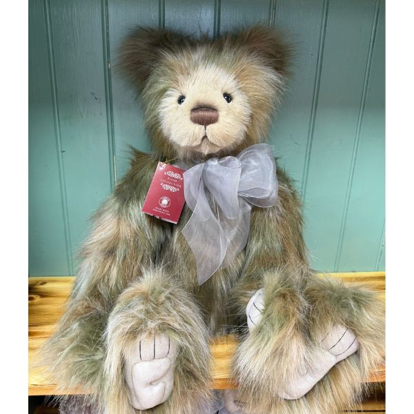Charlie Bears CB252559 Charlie Bears Rosa sitting with visible tag and long plush fur in brown and grey shades