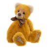 Charlie Bears Mrs Jones plush bear with warm turmeric fur and brown bow sitting upright