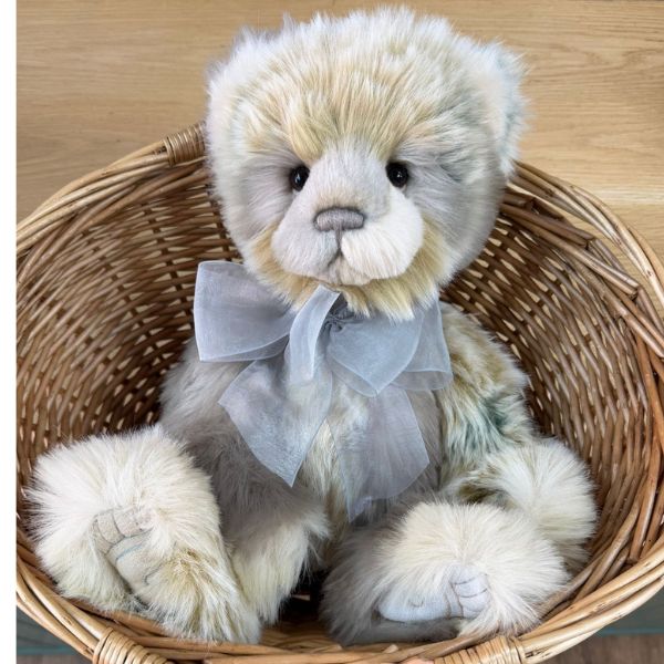 Edyta Charlie Bears Charlie Bears Edyta panda bear nestled in wicker basket showing its soft multi-coloured plush fur