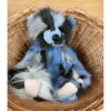 Miss Liddell Charlie Bears Charlie Bears Miss Liddell teddy bear sitting inside wicker basket showing multi-coloured plush fur
