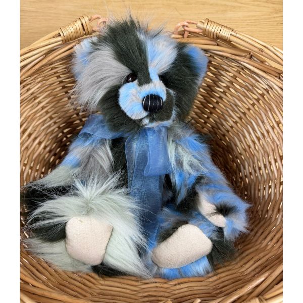 Miss Liddell Charlie Bears Charlie Bears Miss Liddell teddy bear sitting inside wicker basket showing multi-coloured plush fur