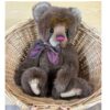 Charlie Bears Mr Brown brown plush bear sitting inside wicker basket with burgundy bow