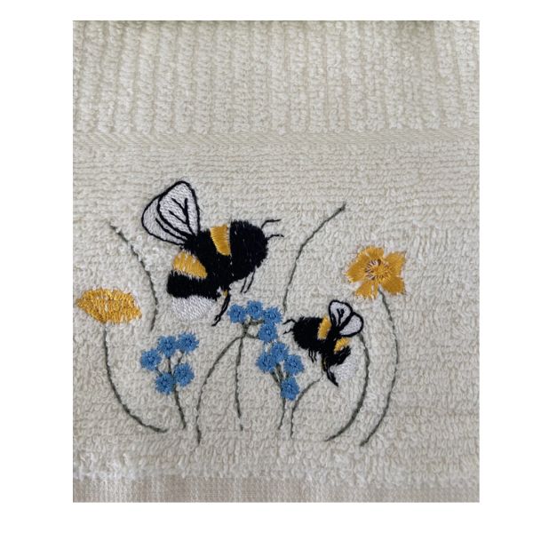 Riggs Bees in Meadow Gift Box Tea Towels-1 Close-up of cream Riggs Bees in Meadow tea towel with embroidered bees and small blue and yellow flowers
