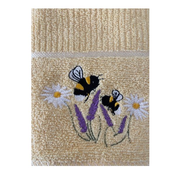 Riggs Bees in Meadow Lemon Close-up of yellow Riggs Bees in Meadow tea towel featuring embroidered bees and purple and white flowers