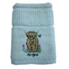 Cream Riggs tea towel with embroidered Angus cow and pink flowers