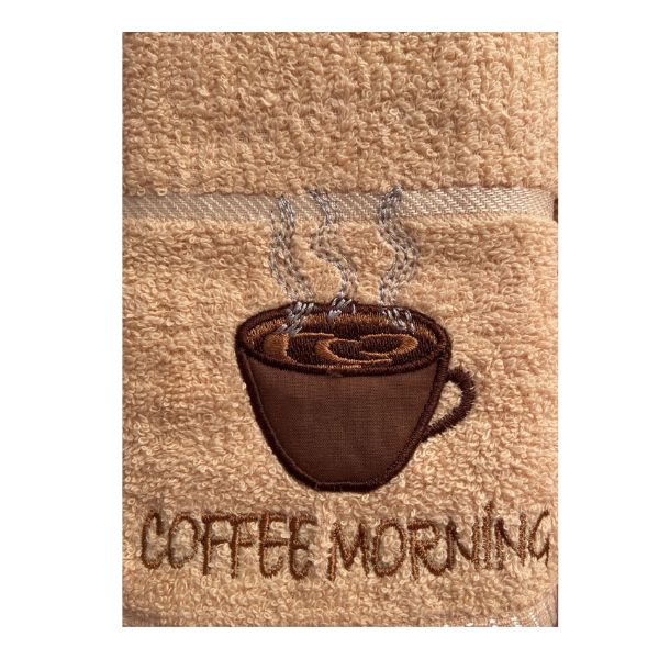 Close-up of embroidered steaming coffee cup on beige Riggs tea towel
